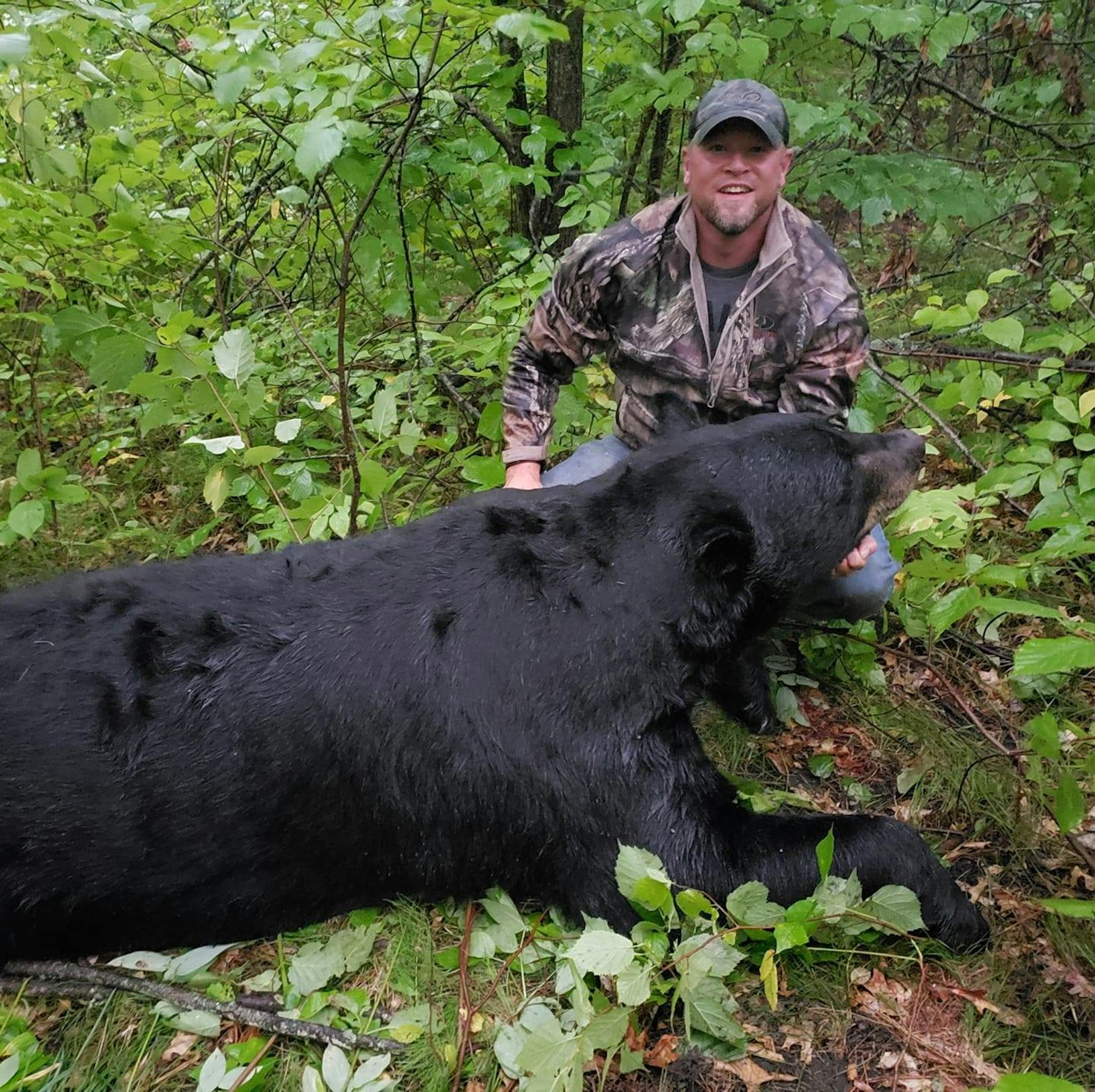 A photo that circulated on Facebook showed Brett Stimac posing with the bear federal authorities say was illegally killed. ORG XMIT: jTTfkDsCmRrjlb9w5AZN ORG XMIT: MIN1912061714334793