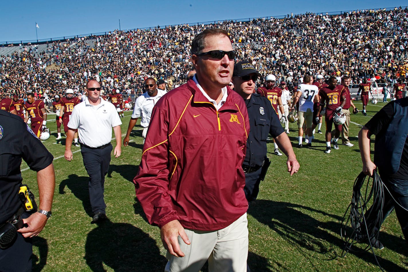 ]MARLIN LEVISON * mlevison@startribune.com October 16, 2010 - GENERAL INFORMATION: University of Minnesota vs. Purdue football. Purdue won 28-17. IN THIS PHOTO: Gophers head coach Tim Brewster left the Purdue playing field at the conclusion of the game.