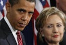 FILE - In this Dec. 1, 2008, file photo, then-President-elect Barack Obama, left, stands with then-Sen. Hillary Rodham Clinton, D-N.Y., after announci