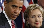 FILE - In this Dec. 1, 2008, file photo, then-President-elect Barack Obama, left, stands with then-Sen. Hillary Rodham Clinton, D-N.Y., after announci