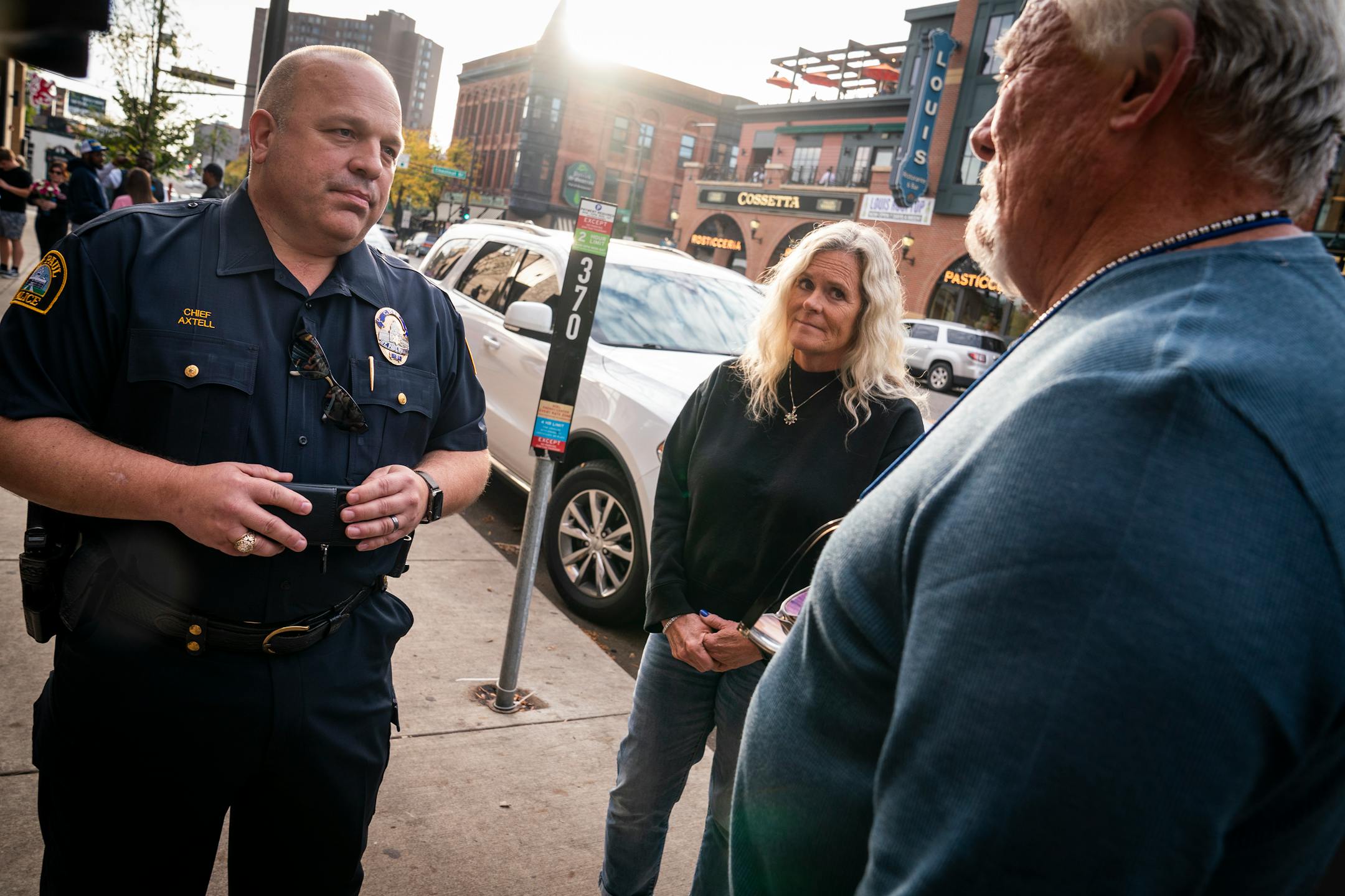 St. Paul Police Chief Todd Axtell, from left, talked to Kim and Rick Firkus, residents of the apartments above Seventh Street Truck Park, outside Seventh Street Truck Park in St. Paul.