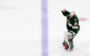 Wild goalie Marc-Andre Fleury, who's retiring, waves to the fans as he skates off the ice after Minnesota was ousted by Vegas in Game 6 on Thursday ni