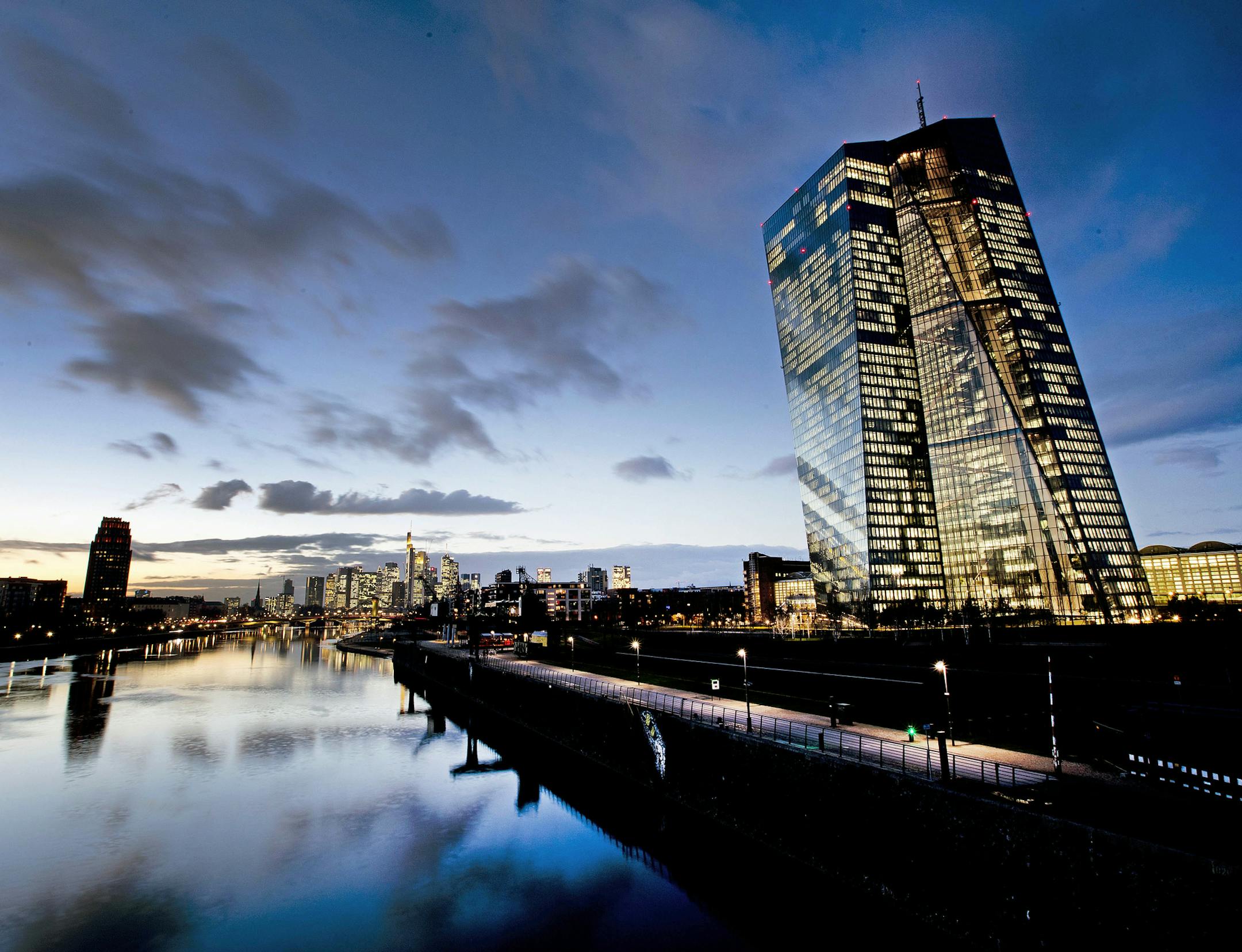 The European Central Bank, right, is seen next to the river Man in Frankfurt, Germany, Tuesday, Dec. 11, 2018. The ECB will have its meeting of the governing council on Thursday. (AP Photo/Michael Probst) ORG XMIT: PFRA110