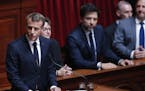 French President Emmanuel Macron addresses both the upper and lower houses of the French parliament at a special session in Versailles, near Paris, Mo