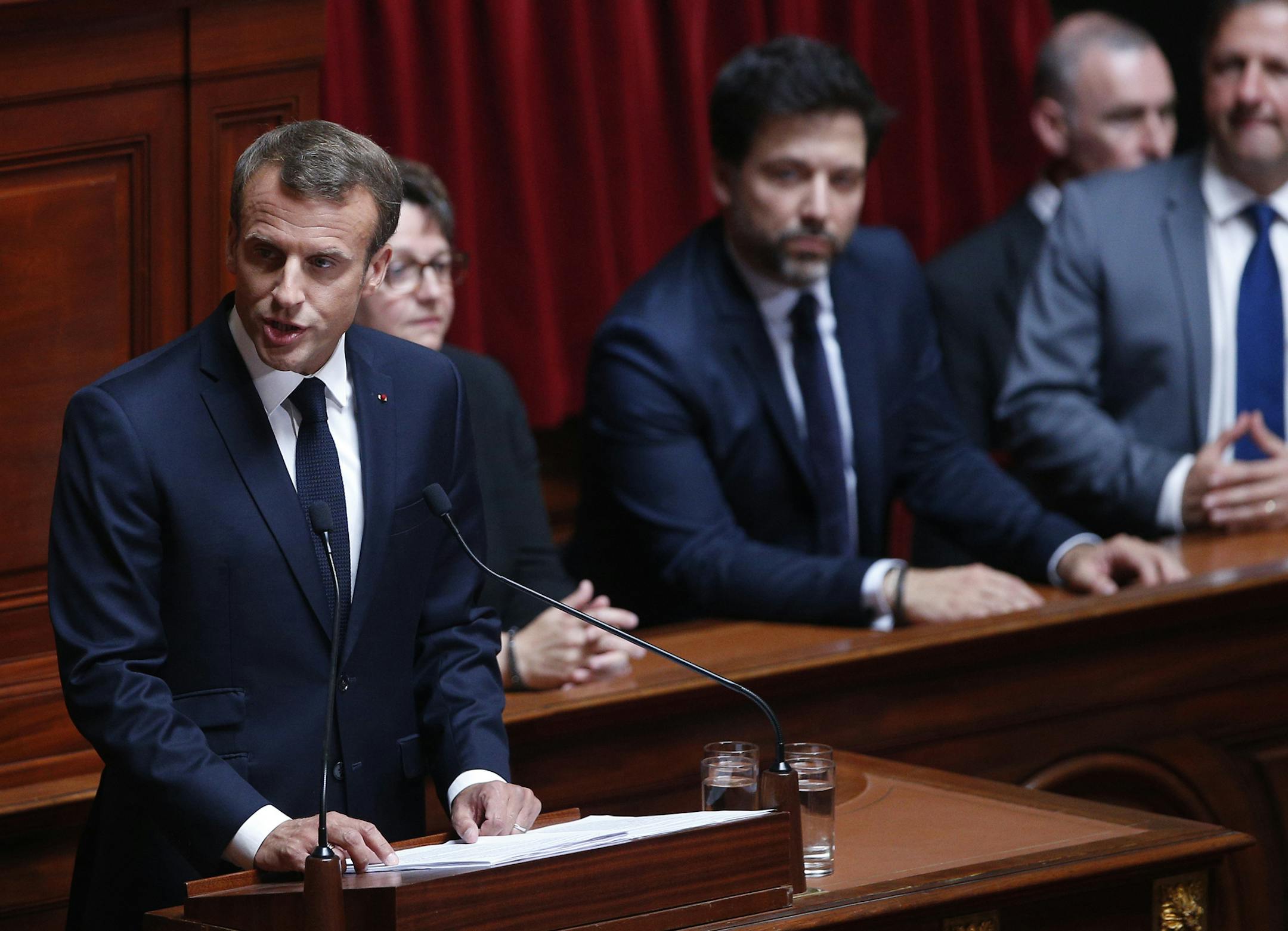 French President Emmanuel Macron addresses both the upper and lower houses of the French parliament at a special session in Versailles, near Paris, Monday, July 9, 2018.