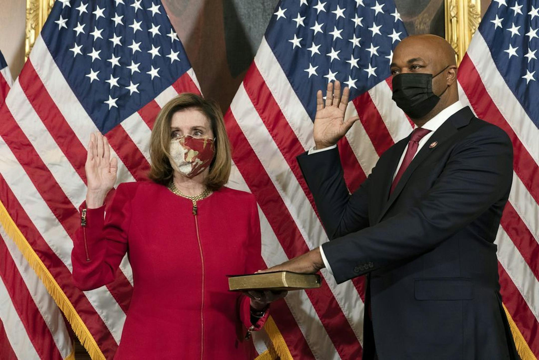 House Speaker Nancy Pelosi, of Calif., holds a ceremonial swearing-in of Rep. Kwanza Hall, D-Ga., on Capitol Hill, Thursday, Dec. 3, 2020, in Washington. Hall will serve the remaining term of the late Rep. John Lewis.