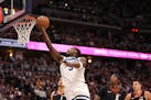 Minnesota Timberwolves guard Anthony Edwards drops in a layup in the first quarter on May 6 at Ball Arena in Denver.