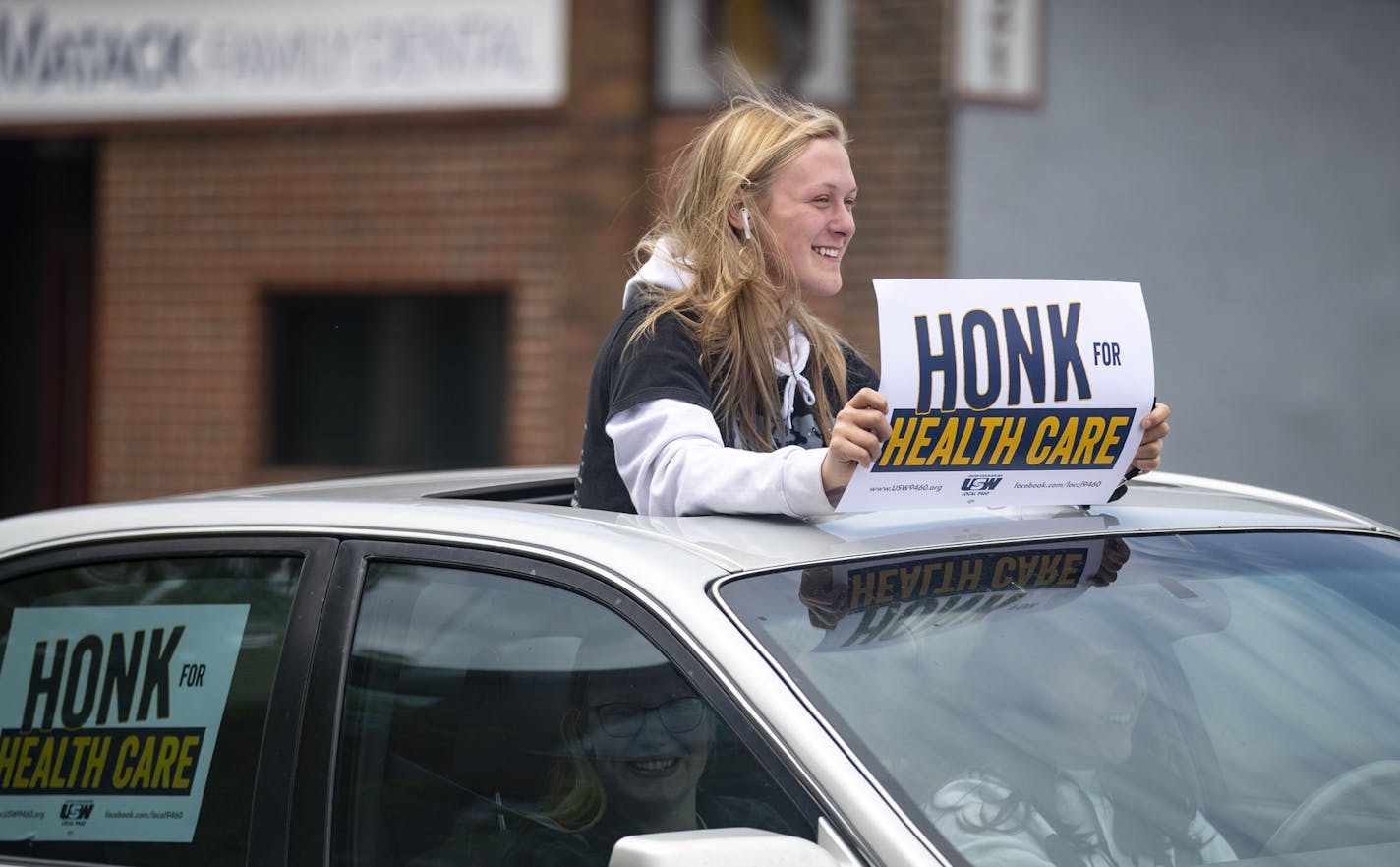 Around 50 vehicles drove down E. Fourth Street in Duluth on Monday, June 1, as they participated in a caravan protesting the layoffs of health care workers by Essentia Health.