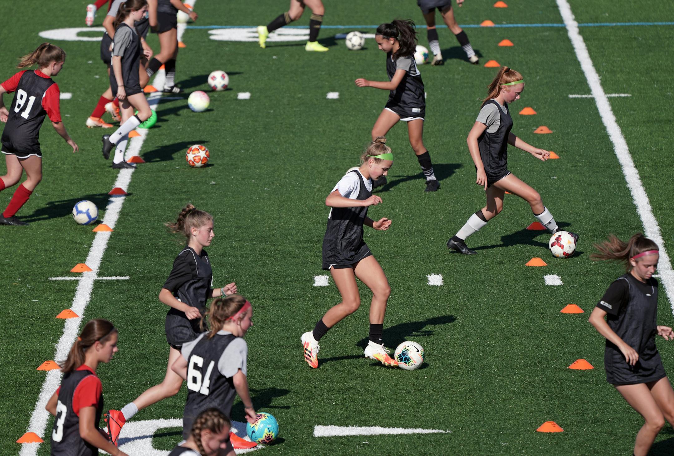 Monday was the first day of practice for prep athletes around the state after COVID-19 shut down sports back in March. Here, Lakeville South High School girls soccer spread out on the practice field for drills Monday morning. brian.peterson@startribune.com St. Paul, MN Monday, August 17, 2020