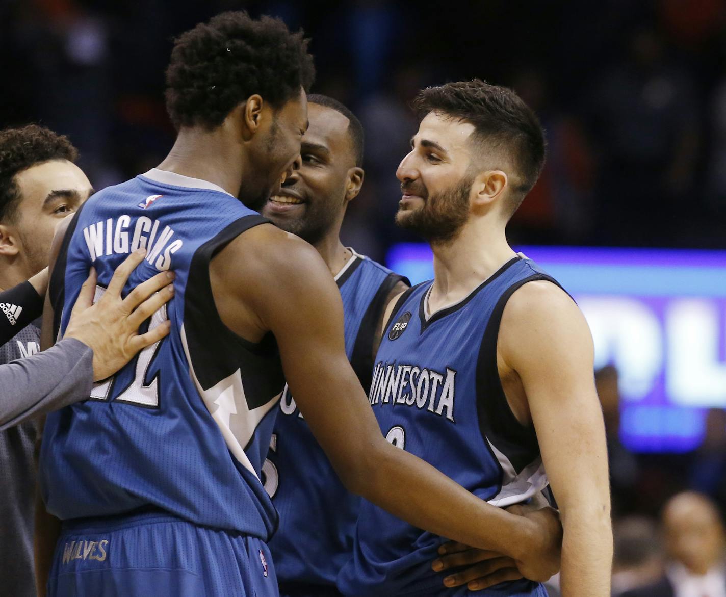 Minnesota Timberwolves guard Ricky Rubio, right, celebrates with teammate guard Andrew Wiggins, left, following an NBA basketball game against the Oklahoma City Thunder in Oklahoma City, Friday, March 11, 2016. Minnesota won 99-96. (AP Photo/Sue Ogrocki)