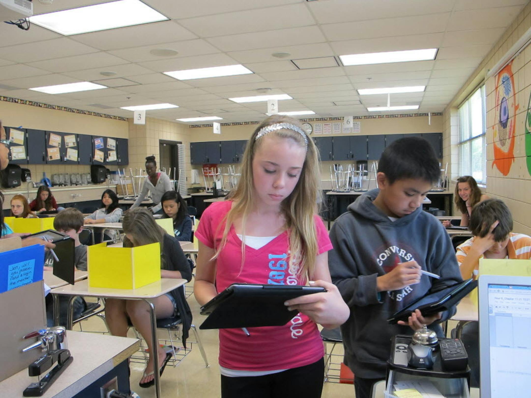 A 2013 photos of seventh grade science class students at East Junior High School in Shakopee using iPads in their classroom.