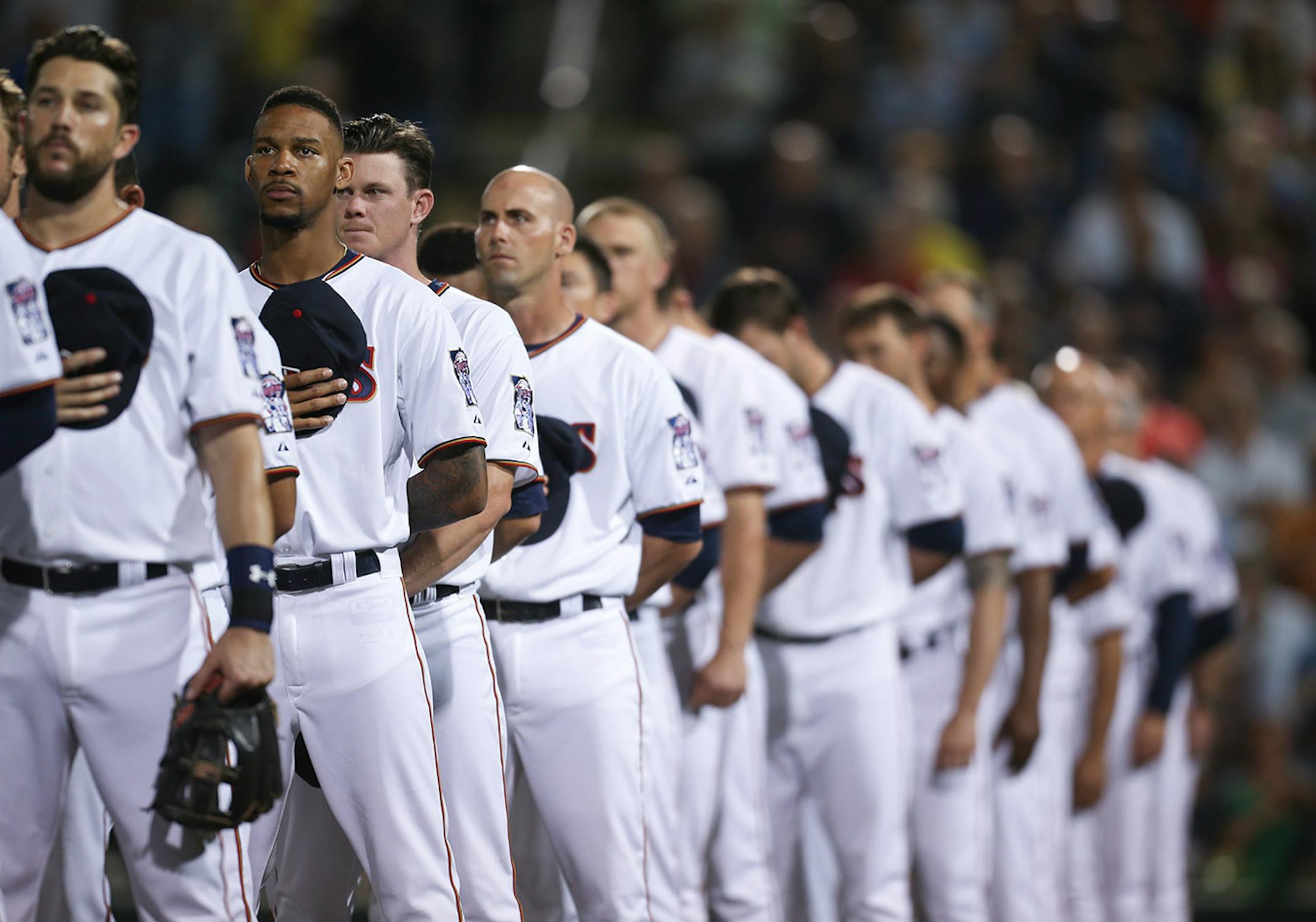 Minnesota Twins center fielder Byron Buxton stood with teammates for the singing of the national anthem before Thursday night's game against the Red Sox to get underway at Hammond Stadium.