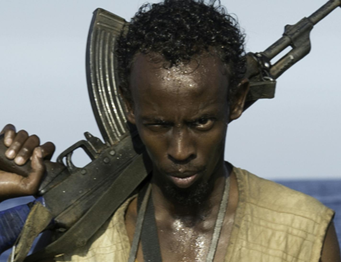 This photo released by Sony - Columbia Pictures shows Barkhad Abdi in a scene from the film, "Captain Phillips. Abdi was nominated for a Golden Globe for best supporting actor in a motion picture for his role in the film on Thursday, Dec. 12, 2013. The 71st annual Golden Globes will air on Sunday, Jan. 12." releasing in the US on Friday, Oct. 11, 2013. (AP Photo/Copyright Sony - Columbia Pictures, Jasin Boland) ORG XMIT: MIN2013121811263627