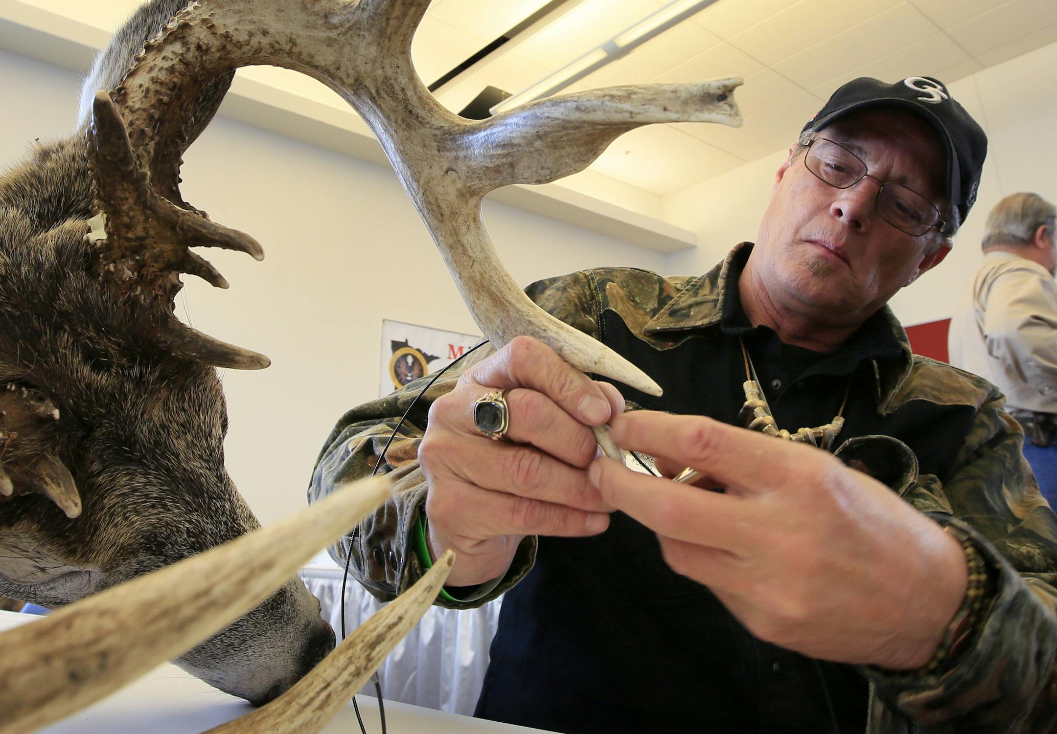The iconic Minnesota Deer Classic has a new home! The National Sports Center is proud to have acquired the show from Hugh Price, the long-time owner of the Minnesota Deer Classic and move it to the NSC campus. Here, one of the Official Minnesota scorers, Shawn Grabow of Sartell, measures a 185 class buck that made the Boon and Crocket record book. ] Blain, MN - 03/07/2012