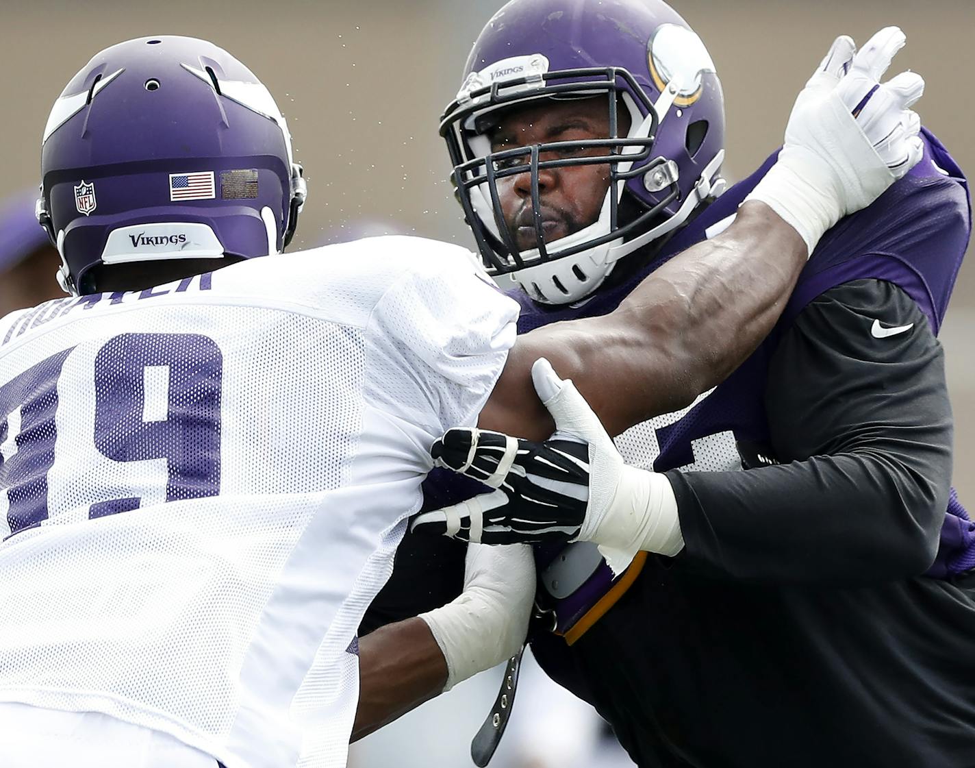 Andre Smith (72) blocked Danielle Hunter (99) during the afternoon practice. ] CARLOS GONZALEZ cgonzalez@startribune.com - July 31, 2016, Mankato, MN, Minnesota State University, Mankato, Minnesota Vikings Training Camp