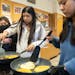 Marlene Gil Ortiz, Jolet Juarez Parra and Judith Cortes Rosas, left to right, cook pupusas during a culinary arts class at Roosevelt High School in Mi