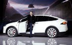 FILE - In this Sept. 29, 2015, file photo, Elon Musk, CEO of Tesla Motors Inc., introduces the Model X car at the company's headquarters in Fremont, C