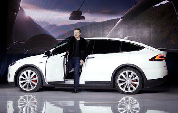 FILE - In this Sept. 29, 2015, file photo, Elon Musk, CEO of Tesla Motors Inc., introduces the Model X car at the company's headquarters in Fremont, C