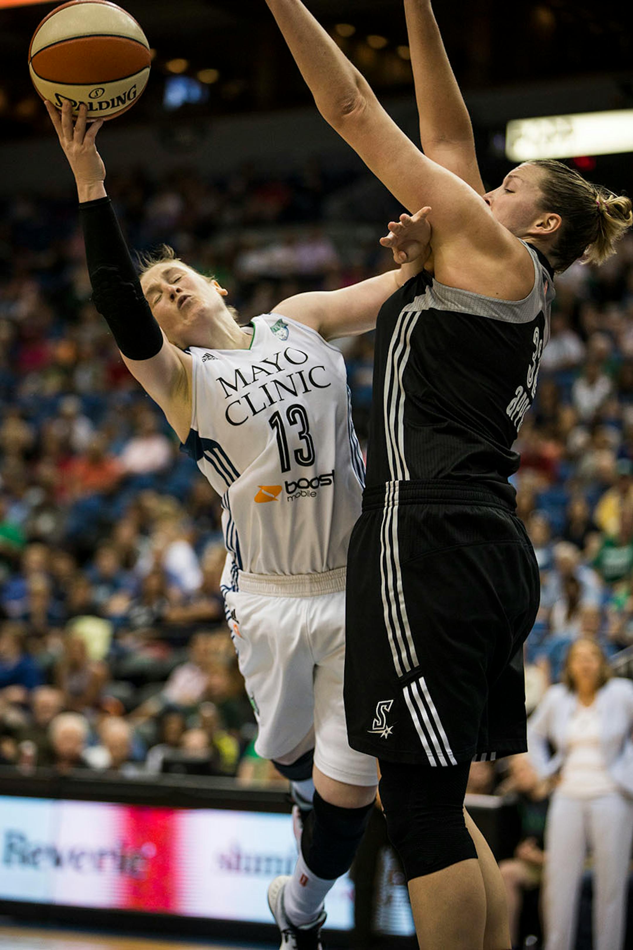 Lynx Lindsay Whalen jumped into San Antonio's Jayne Appel in the second half.