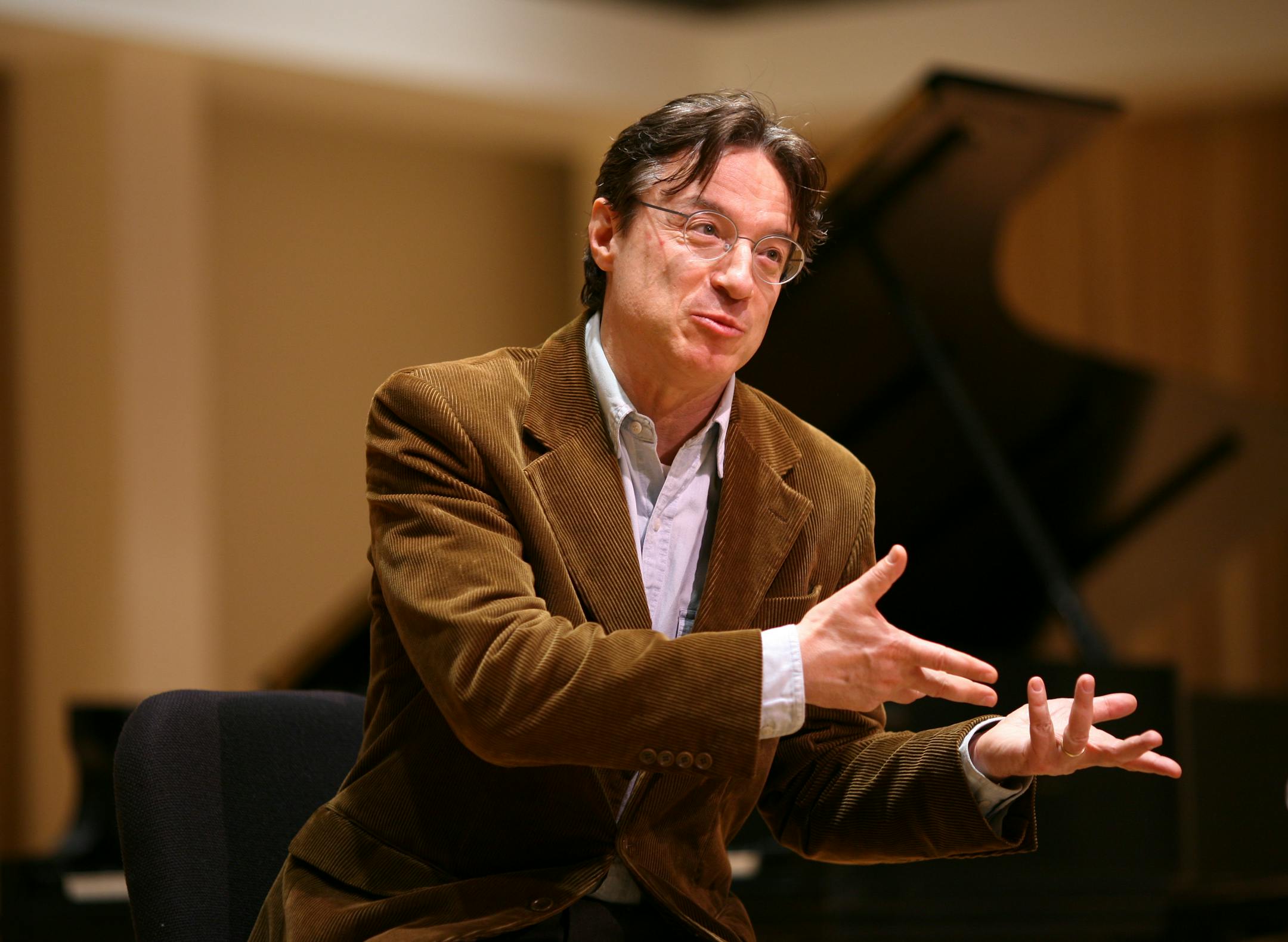Roberto Abbado during an interview Tuesday evening in the SPCO's new performance space, the Huss Music Room, at the orchestra's headquarters in the Hamm Building in downtown St. Paul. He recalled that some of his earliest musical memories were of laying on the floor underneath the family's grand piano while his father rehearsed. GENERAL INFORMATION: JEFF WHEELER � jwheeler@startribune.com ST. PAUL - 4/18/06 - This weekend conductor Roberto Abbado starts three weeks of concerts here as the St. Pa