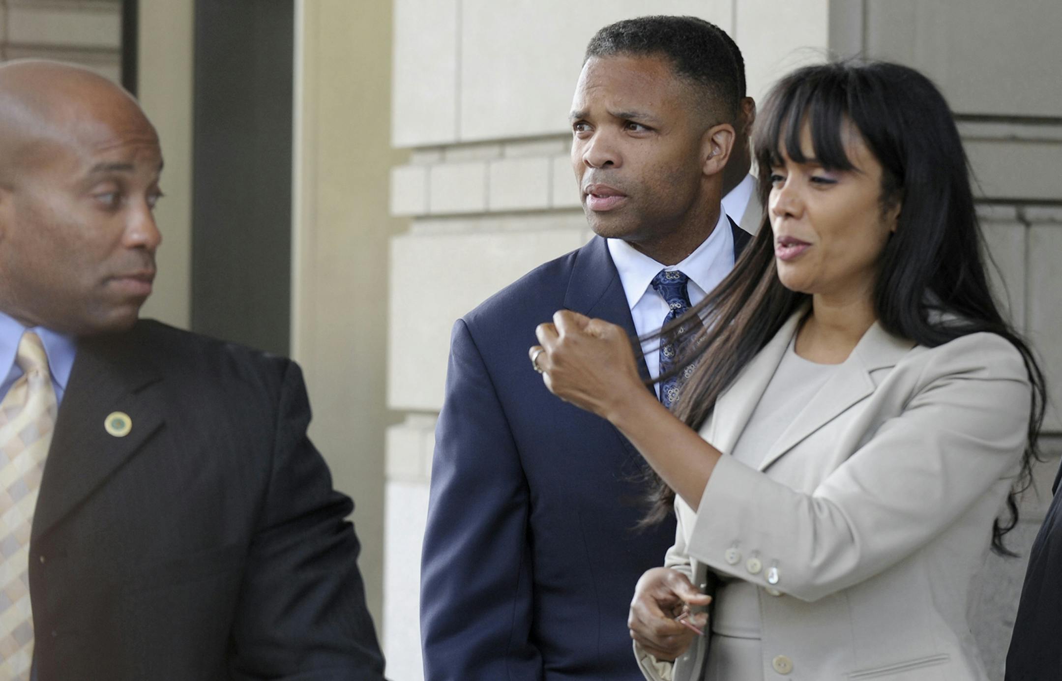 Former Illinois Rep. Jesse Jackson Jr., and his wife Sandra, leaves federal court in Washington, Wednesday, Aug. 14, 2013. Jackson was sentenced to two and a half years in prison Wednesday after pleading guilty to scheming to spend $750,000 in campaign funds on TV's, restaurant dinners, an expensive watch and other costly personal items. His wife received a sentence of one year. (AP Photo/Susan Walsh) ORG XMIT: MIN2013081418463576