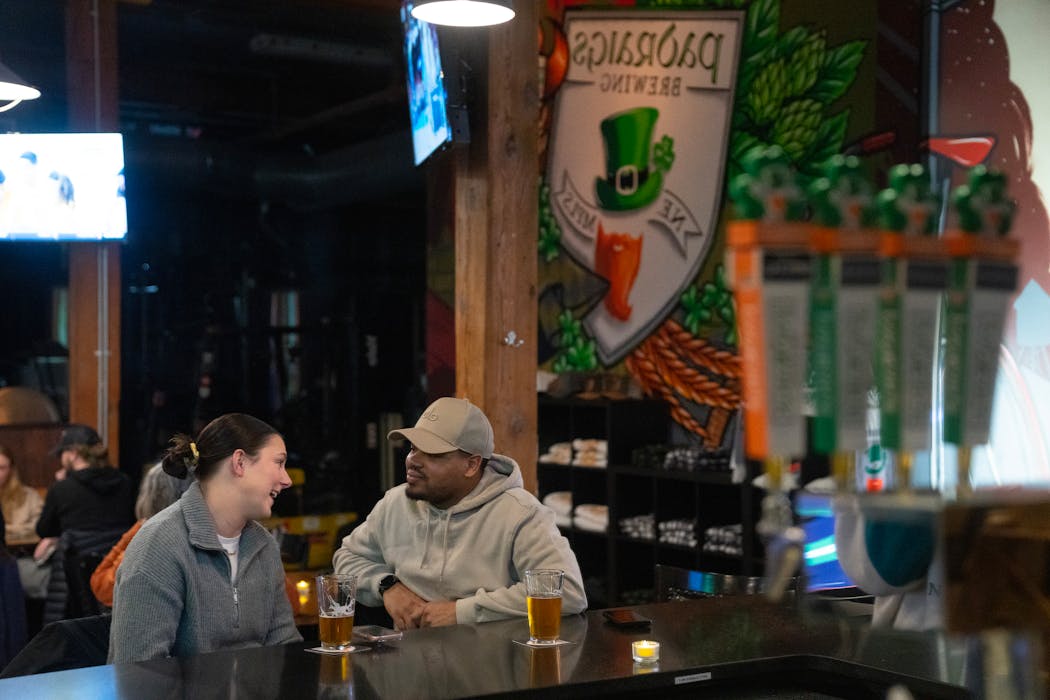 Morgan Pike, left, and Stefan Jones enjoyed beers at the bar at Padraigs Brewing on Feb. 2 in Minneapolis.