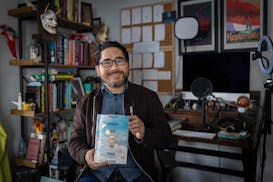Minneapolis writer Sequoia Nagamatsu, whose new novel "How High We Go in the Dark" poses for a photo in the office where he wrote it, Friday, Jan. 7, 