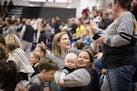 Lindsay Whalen greets people in the crowd after the ceremony.where the remodeled Hutchinson High School gym was named for her.