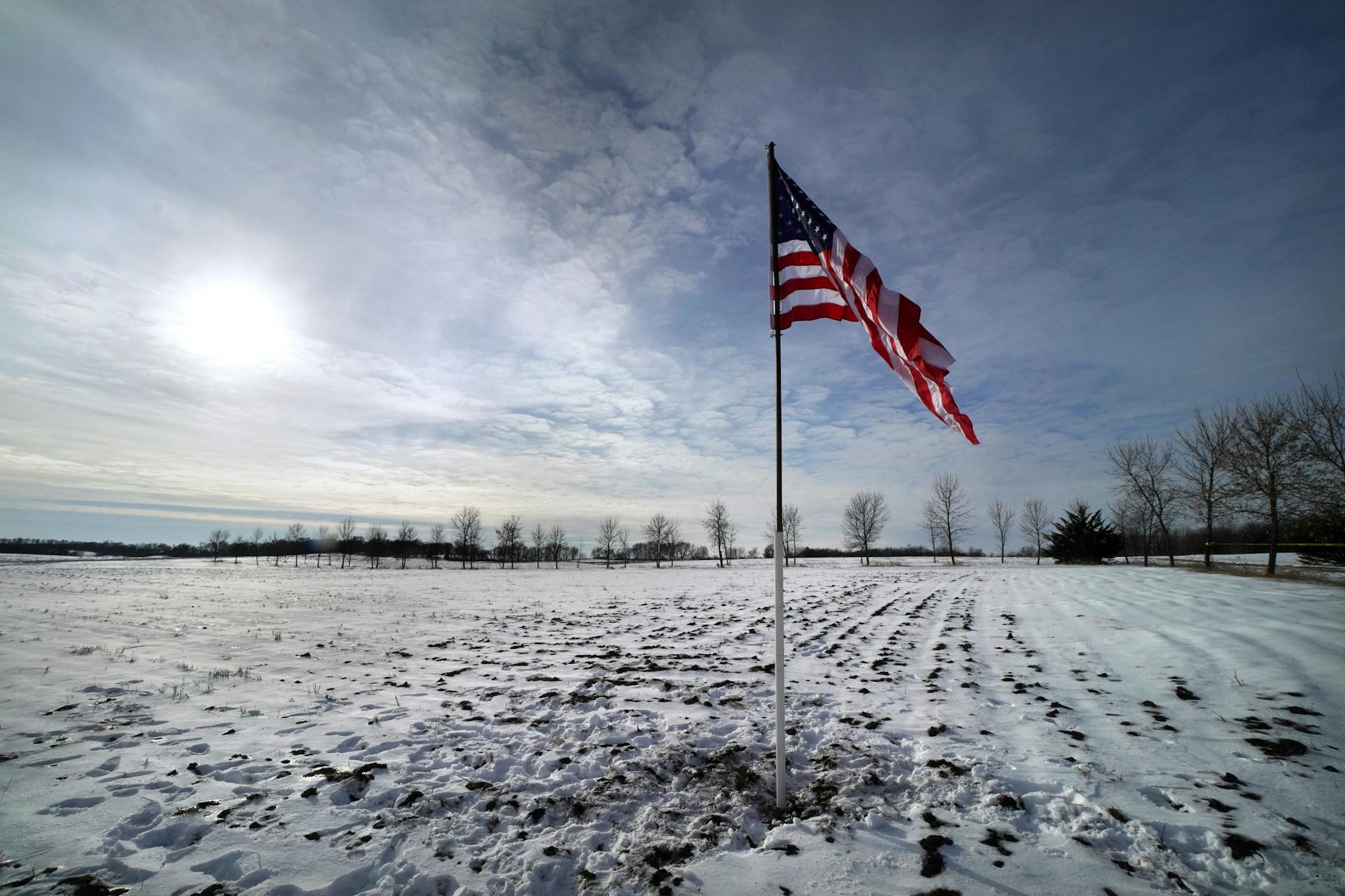 A lone flag has been posted in a field near the crash site of the National Guard helicopter Friday afternoon near Marty, Minn.