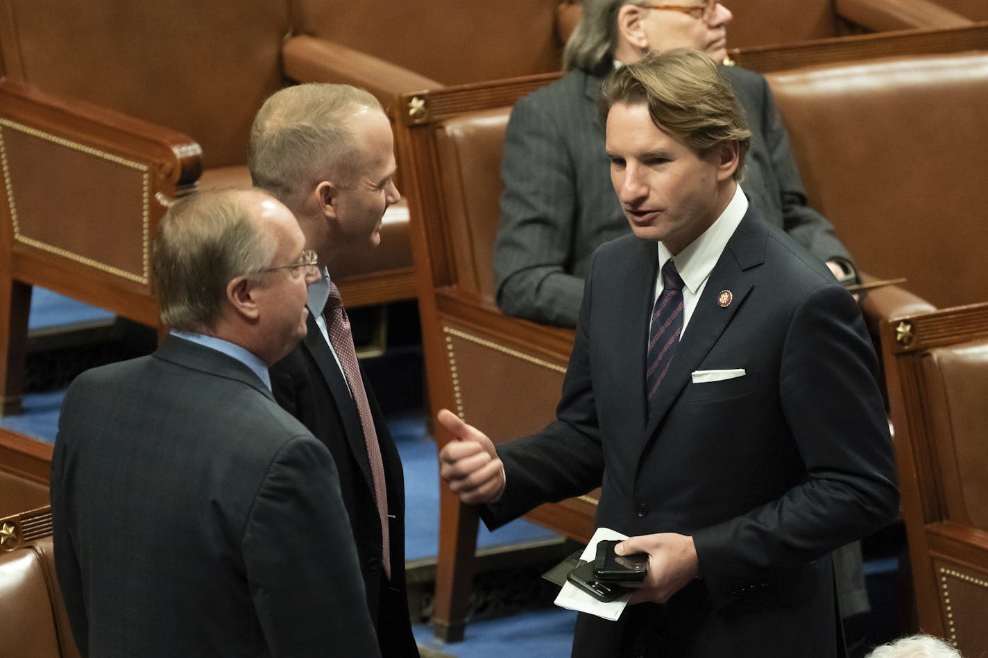 Dean Phillips, right, on the floor with Rep. Jim Hagedorn. (Glen Stubbe/Star Tribune)