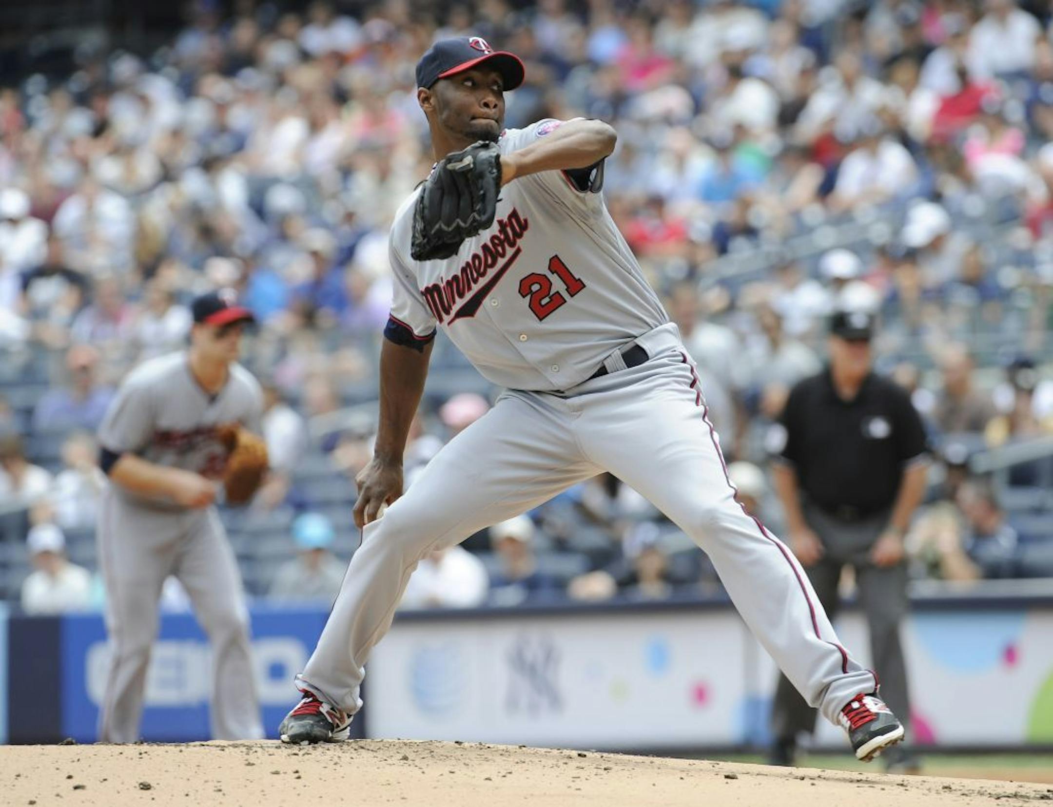 Minnesota Twins pitcher Samuel Deduno delivers the ball to the New York Yankees during the first inning of a baseball game Saturday, July 13, 2013, at Yankee Stadium in New York.
