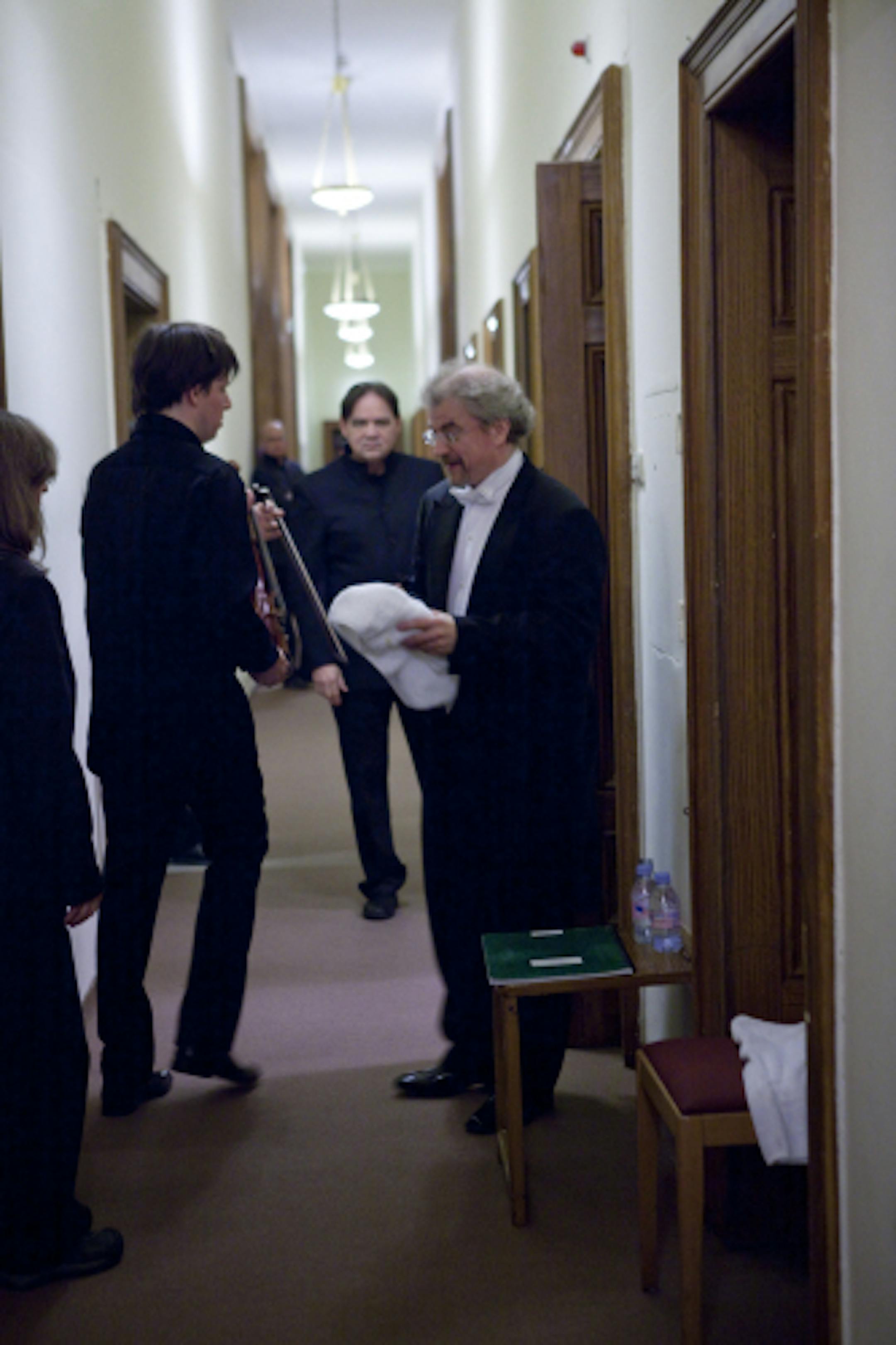 Joshua Bell, stage manager Tim Eickholt and Osmo Vanska backstage at the Musikverein after the Minnesota Orchestra's tour-ending concert in Vienna.