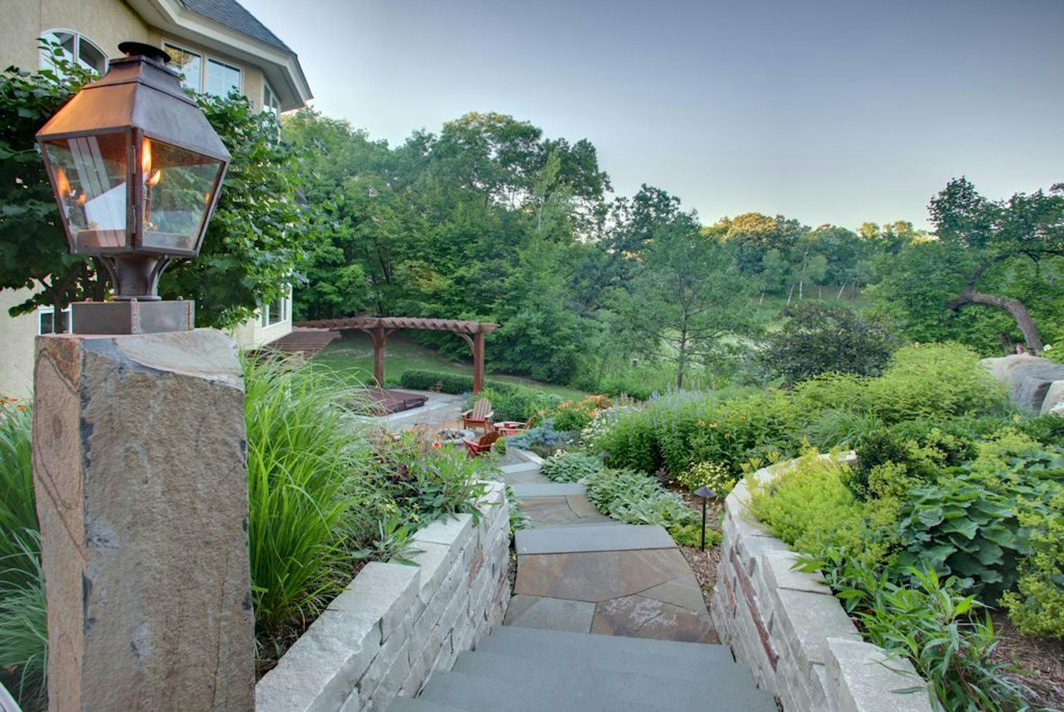 The pool area slopes down to a patio.