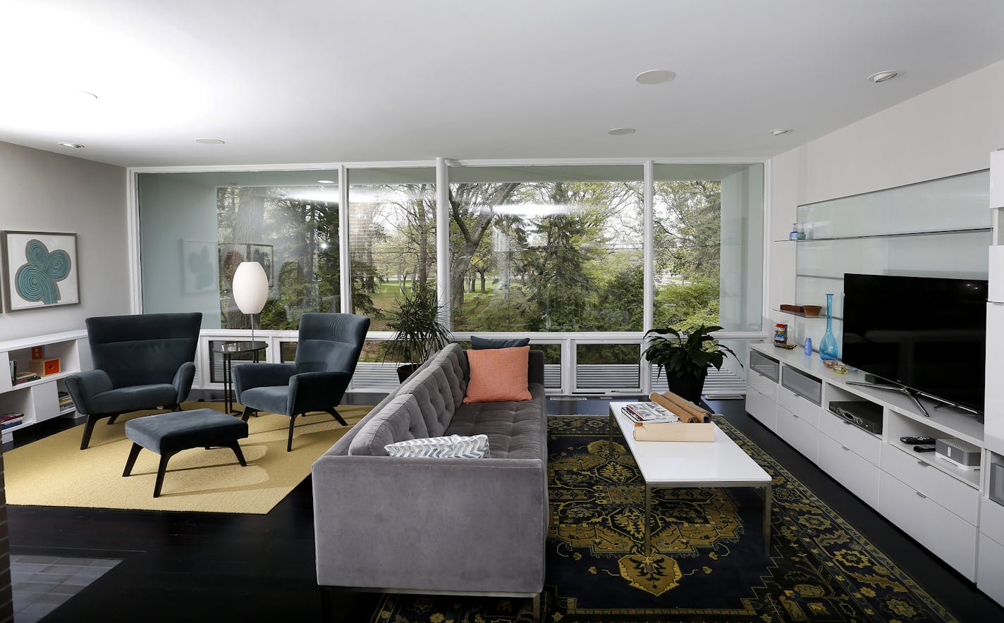 Dan Voytas added new built-ins and recycled wood and fiber floors to his 1950s living room. The wall of windows overlooks the University of Minnesota Golf Course in Falcon Heights.