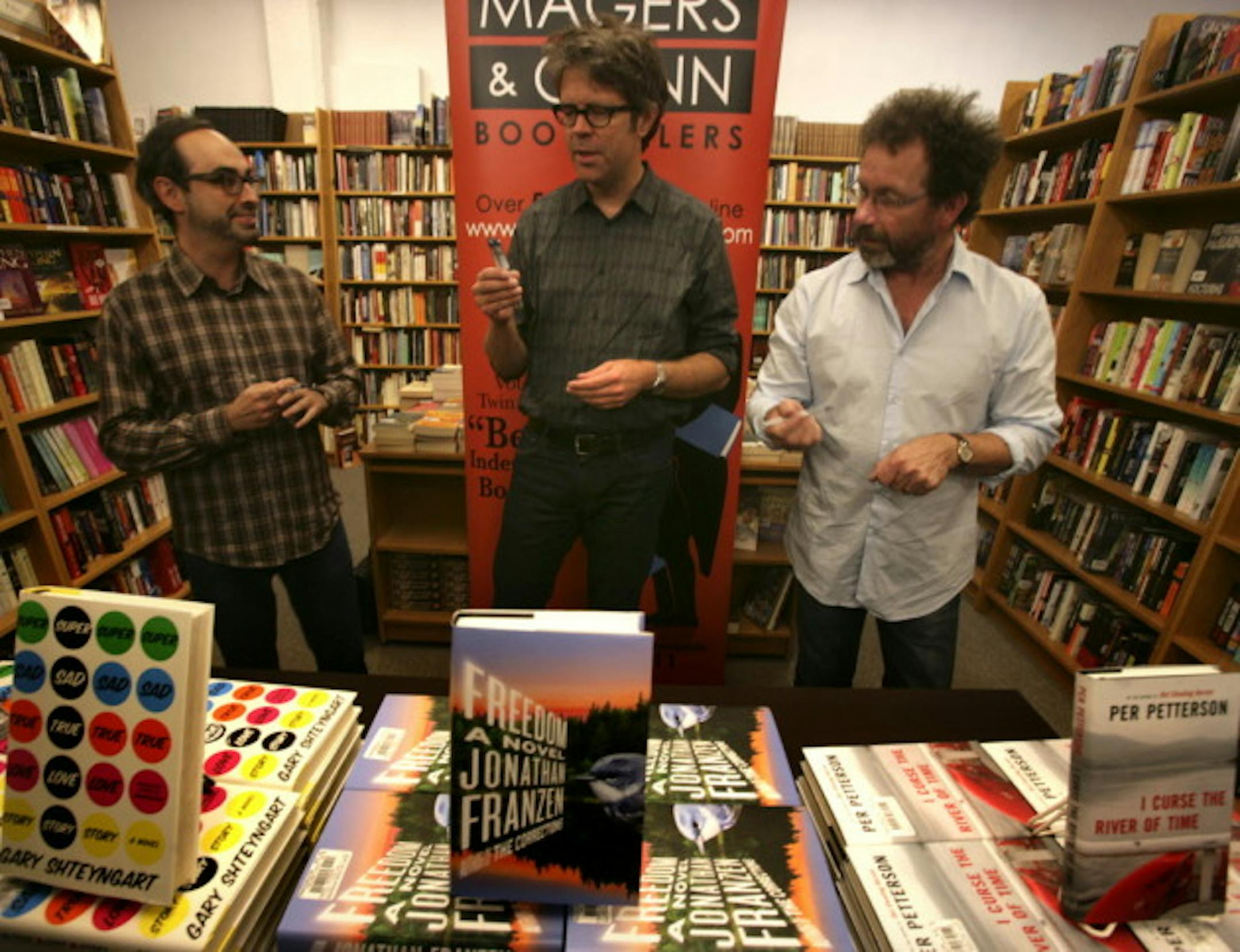 Authors Gary Shetyngart, Jonathan Franzen and Per Petterson sign stock at Magers & Quinn in September 2010. File photo by Joel Koyama