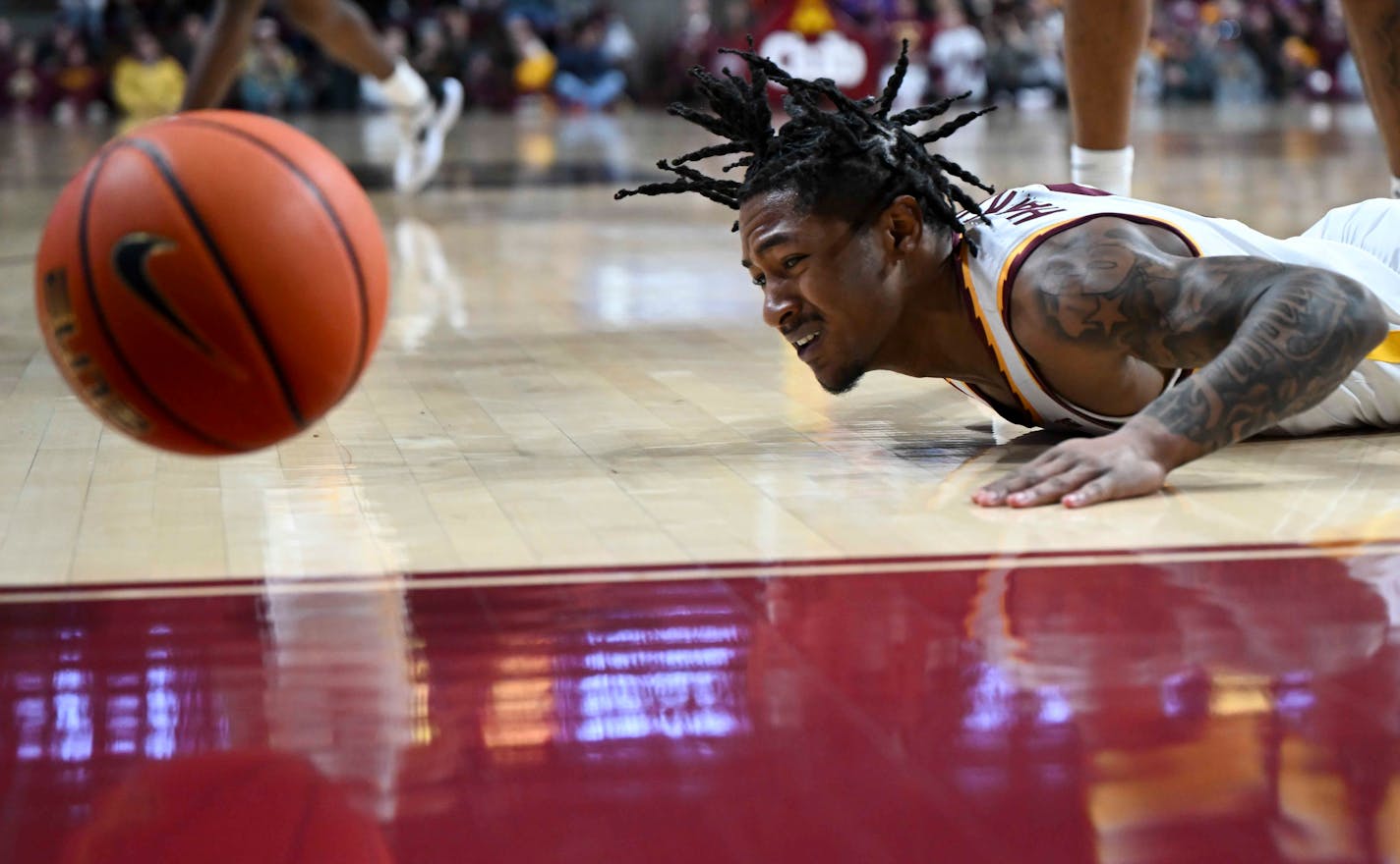 Minnesota Gophers guard Elijah Hawkins (0) loses the ball out of bounds against the Iowa Hawkeyes in the first half Monday, Jan. 15, 2024 at Williams Arena in Minneapolis, Minn..