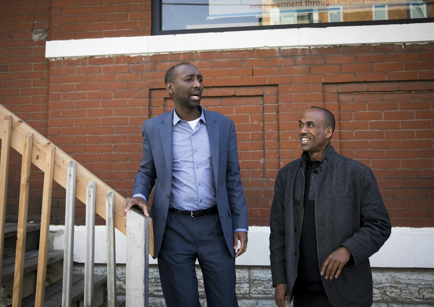 Mohamud Noor, left, next to Mustafa Hassan, chatted with a person leaving the job center on Wednesday, October 19, 2016, in Minneapolis, Minn. ] RENEE JONES SCHNEIDER &#x2022; renee.jones@startribune.com