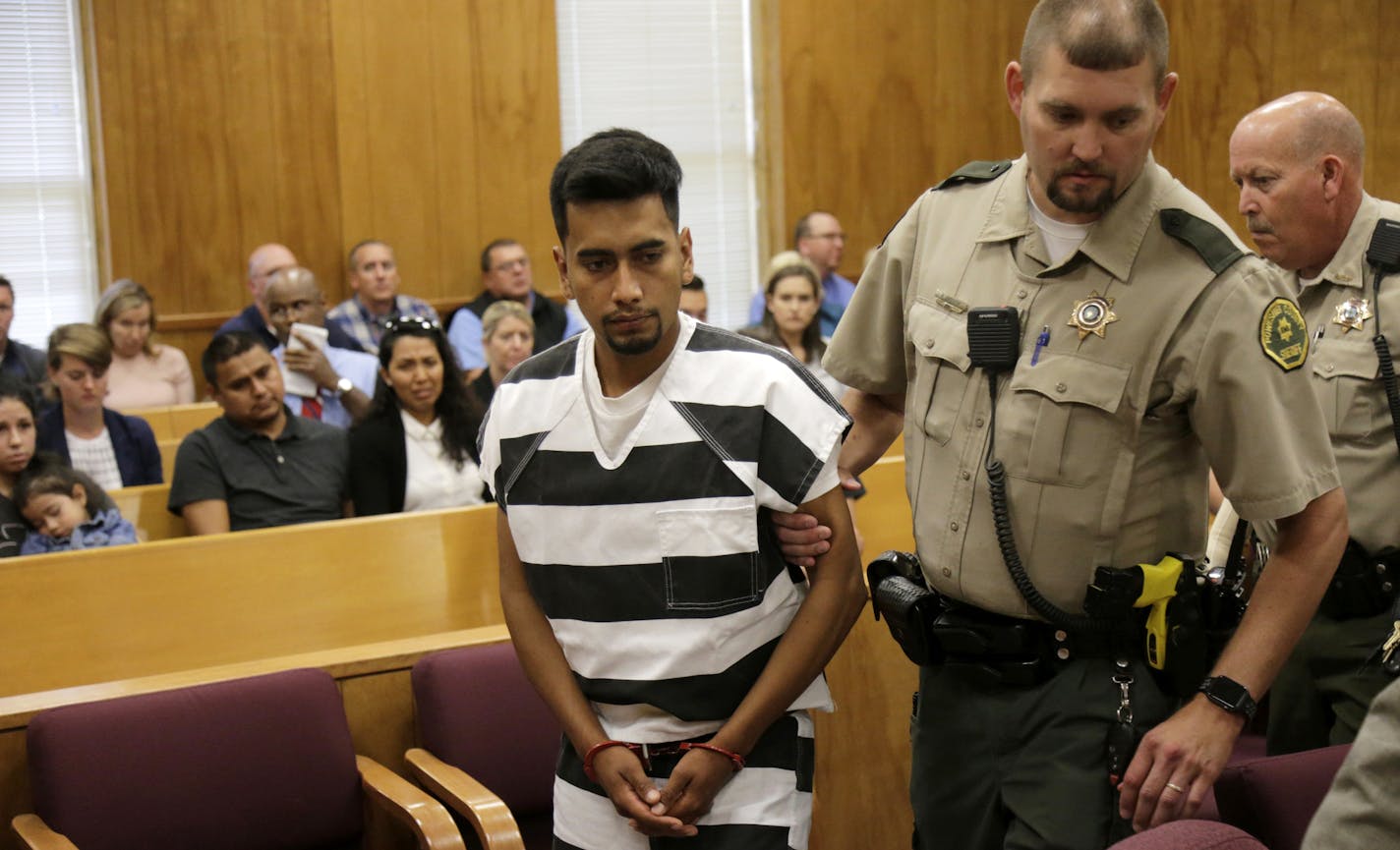 Cristhian Bahena Rivera is lead into the courtroom for his initial court appearance, Wednesday, Aug. 22, 2018, at the Poweshiek County Courthouse in Montezuma, Iowa. Rivera is charged with first-degree murder in the death of Mollie Tibbetts, who disappeared July 18 from Brooklyn, Iowa. (Jim Slosiarek/The Gazette via AP, Pool)