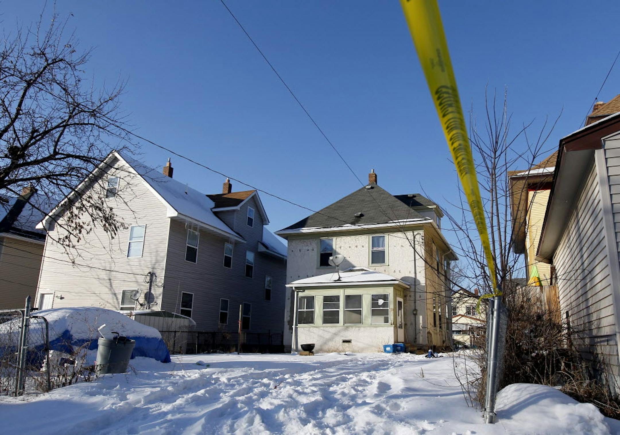 The scene in the alley of the 700 block of Aurora Avenue in St. Paul, where authorities shot and killed a man Tuesday afternoon after he fatally stabbed a St. Paul police dog in the basement.