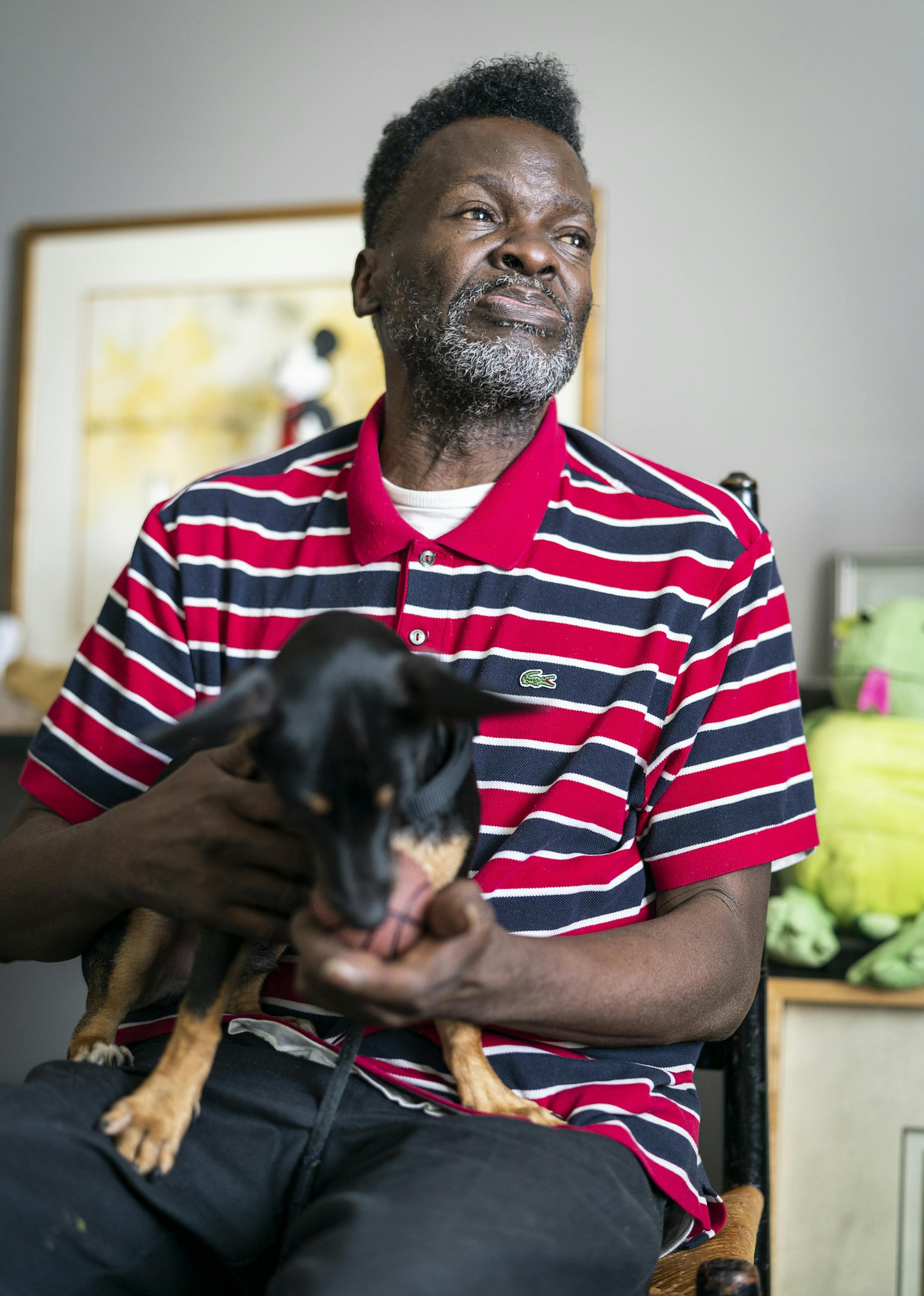 Ray Brooks sat at home in Clare Housing Midtown with his dog Tori Tornado, a chihuahua and terrier mix. ] LEILA NAVIDI • leila.navidi@startribune.com BACKGROUND INFORMATION: Ray Brooks, who is HIV positive, is a resident of Clare Housing Midtown in Minneapolis on Wednesday, August 21, 2019. Clare Housing, a supportive housing community for people living with HIV, is receiving funding from the Department of Housing and Urban Development for more than $951,000.