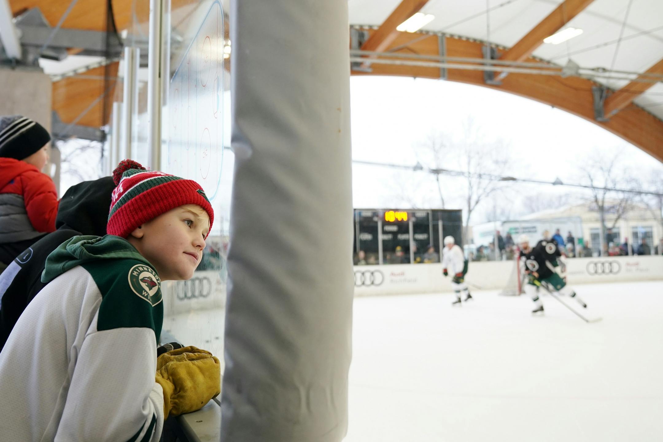 Minnesota Wild fan Crew Lund, 12, of St. Louis Park watched from near the bench during the Wild's outdoor practice Thursday.