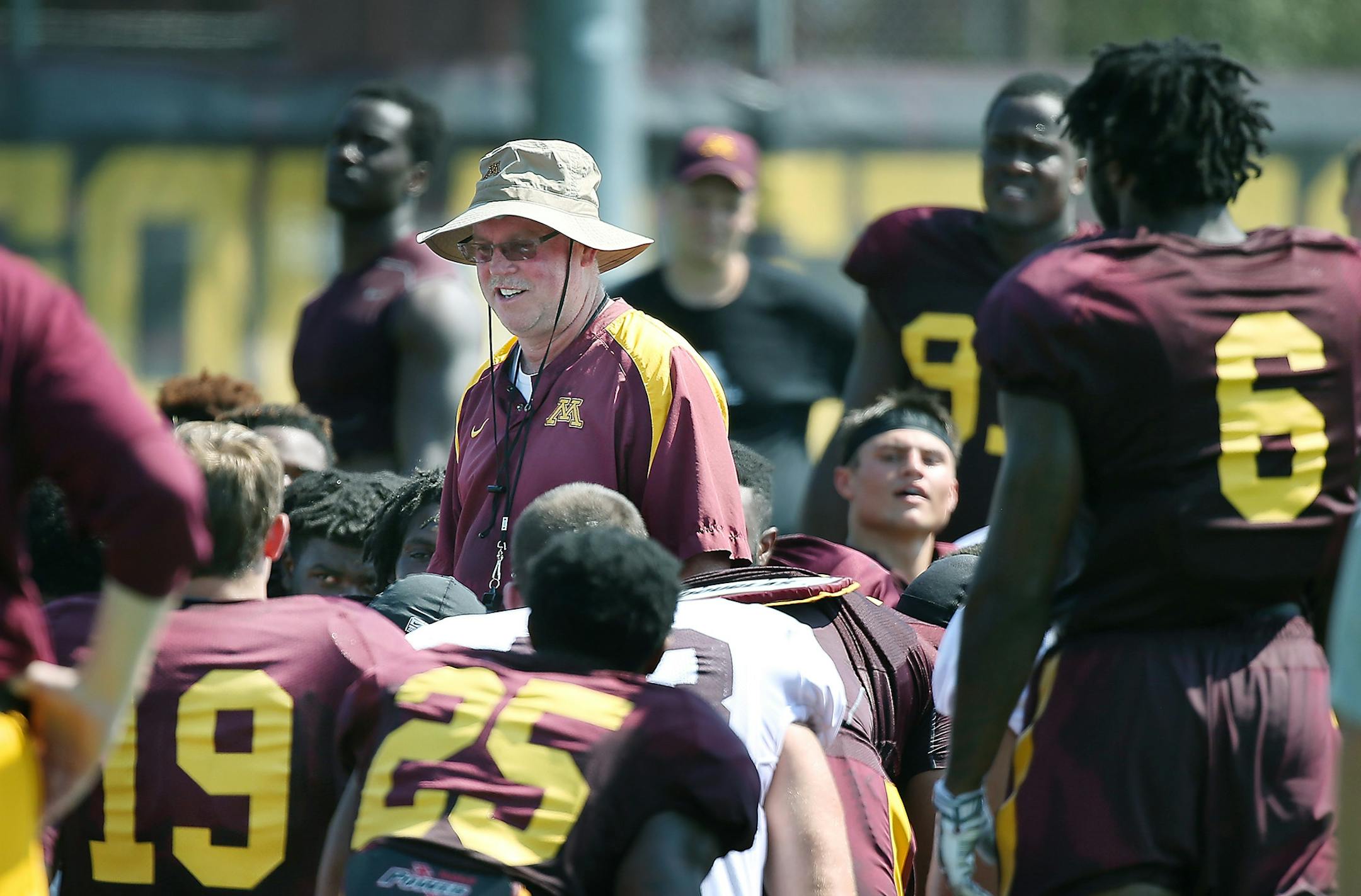 Jerry Kill, who received a one-year contract extension and $300,000 raise, talked to his players after Friday's practice.
