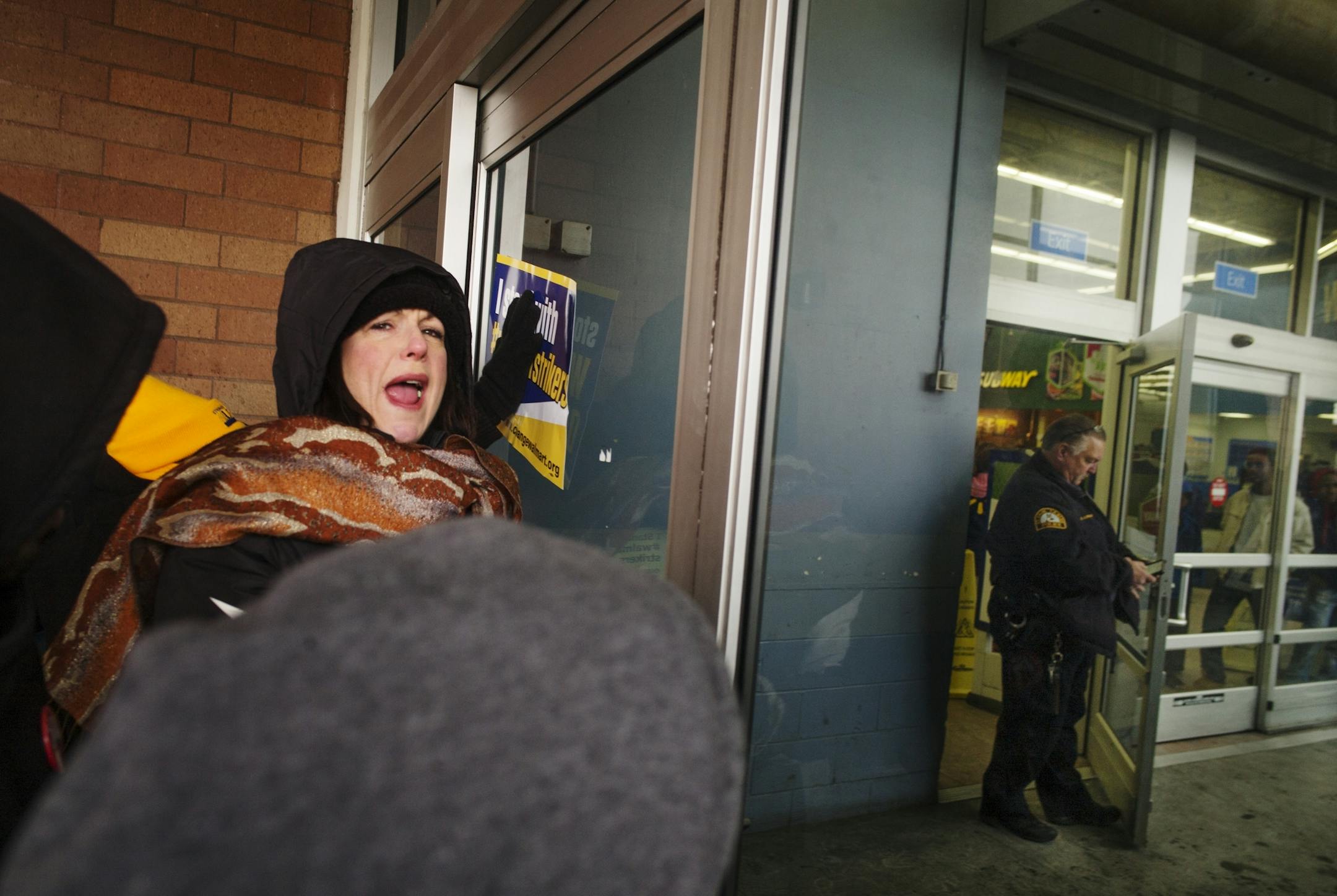 At the Walmart near the intersection of Snelling and University in St. Paul, protesters tried to enter the Walmart to demand for better wages and working conditions from the giant retialer. Police helped lock down the premise and prevent entry from the 200+ throng.
