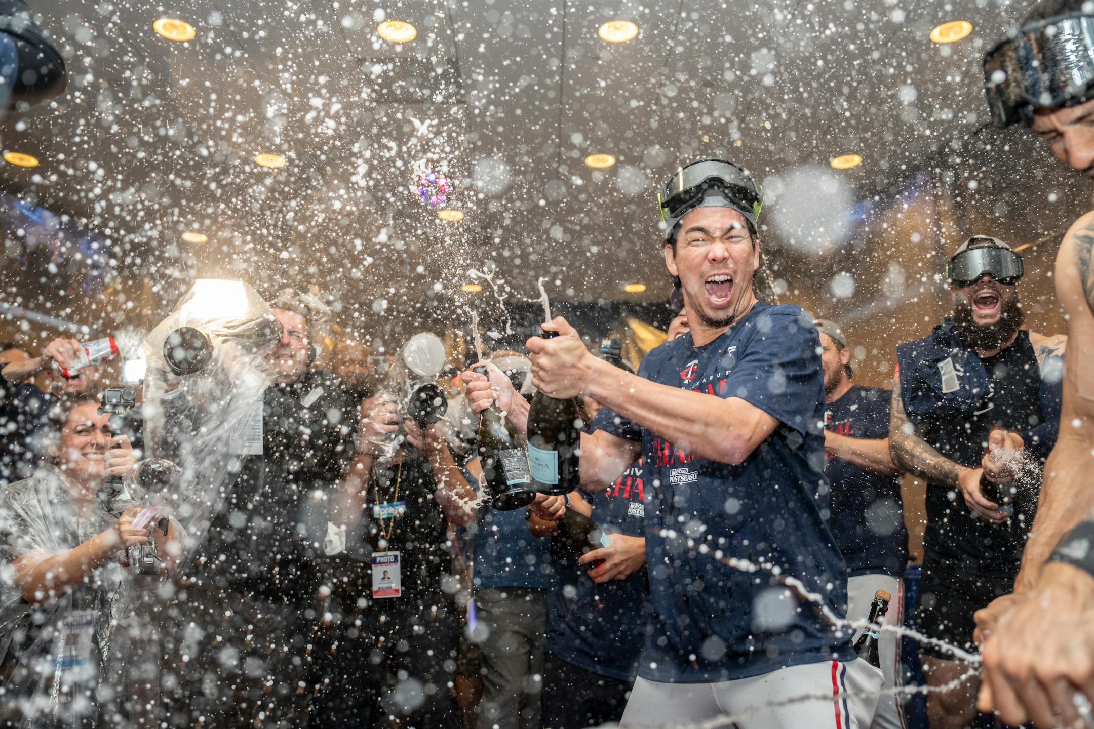 Minnesota Twins starting pitcher Kenta Maeda (18) and other Twins players celebrate with champagne in the locker room after clentched the American League Central title. The Minnesota Twins hosted the Los Angeles Angels at Target Field on Friday, Sept. 22, 2023 in Minneapolis, Minn. ] RENEE JONES SCHNEIDER • renee.jones@startribune.com