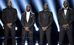 FILE - In this July 13, 2016, file photo, NBA basketball players Carmelo Anthony, Chris Paul, Dwyane Wade and LeBron James, from left, speak on stage 