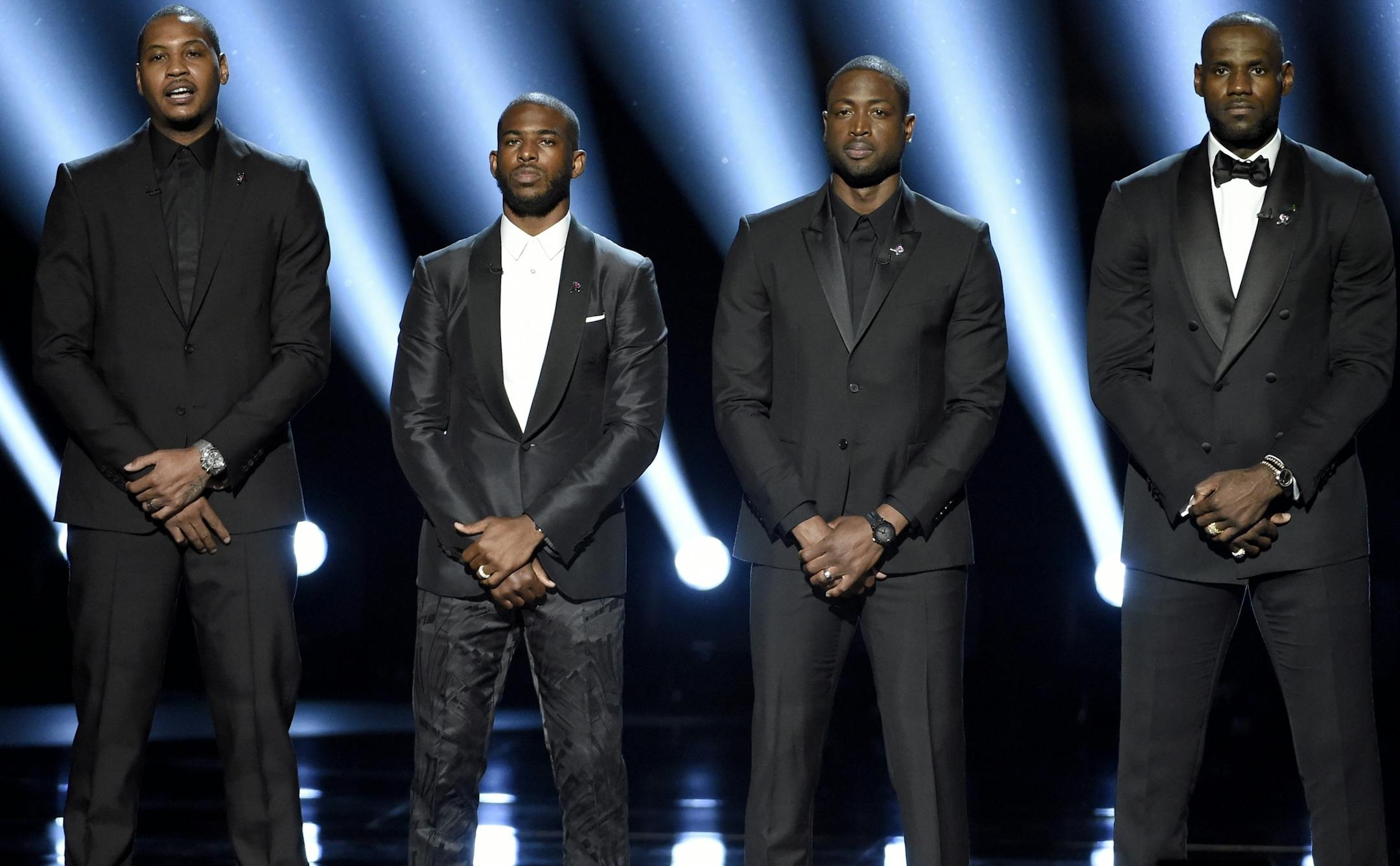 FILE - In this July 13, 2016, file photo, NBA basketball players Carmelo Anthony, Chris Paul, Dwyane Wade and LeBron James, from left, speak on stage at the ESPY Awards in Los Angeles. The four gave an anti-violence speech and expressed their support of the values behind the Black Lives Matter movement.