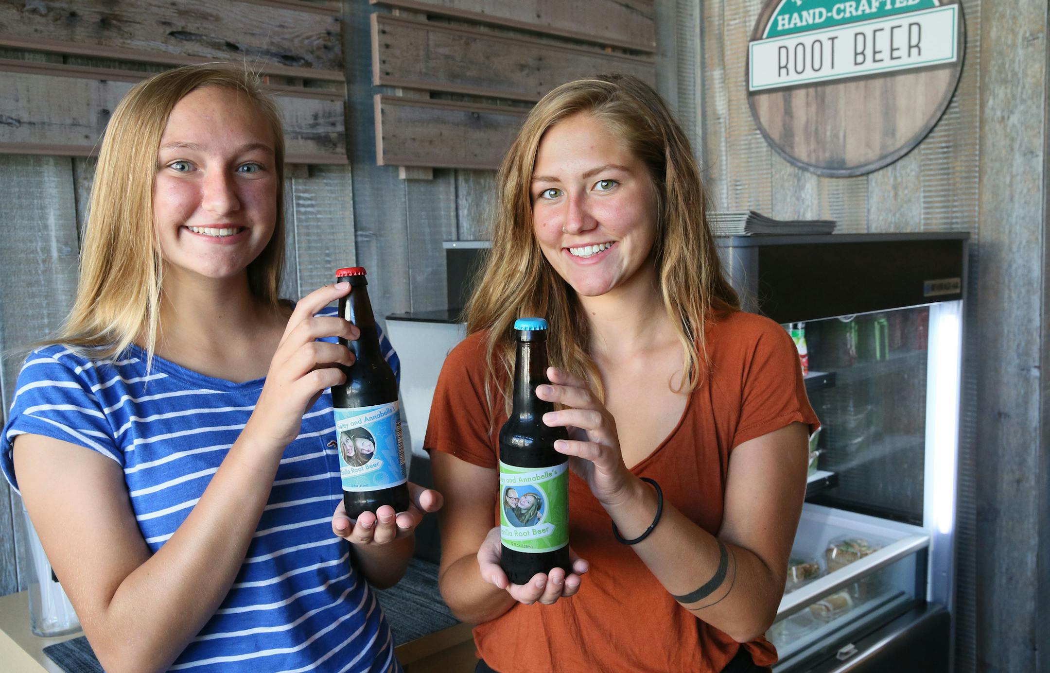 Sisters Haley Jurena, right, 18, and Annabelle Jurena, 13, pose for a portrait with their family's root beer, Haley and Annabelle Vanilla Root Beer available in both diet and regular, in Milwaukee, Wis. (Michael Sears/Milwaukee Journal Sentinel/TNS) ORG XMIT: 1189358