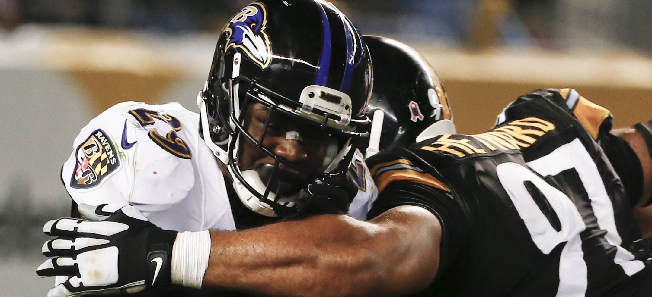 Baltimore Ravens running back Justin Forsett (29) is hit by Pittsburgh Steelers defensive end Cameron Heyward (97) as he runs the ball in an NFL football game, Thursday, Oct. 1, 2015 in Pittsburgh. (AP Photo/Gene J. Puskar)