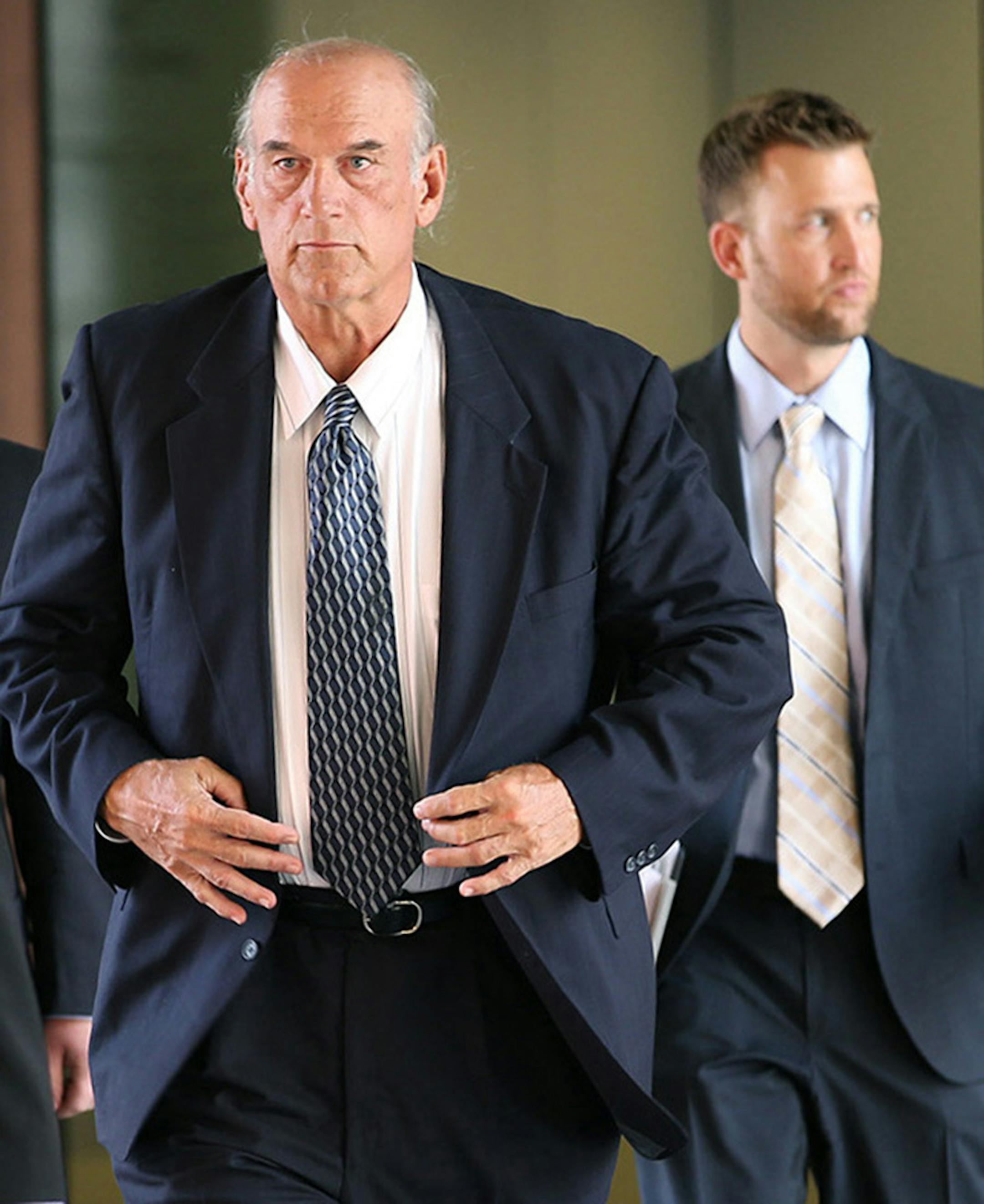 Former Minnesota Governor Jesse Ventura made his way out of the Warren E. Burger Federal Building during the first day of jury selection in the defamation lawsuit, Tuesday, July 8, 2014 in St. Paul, MN.