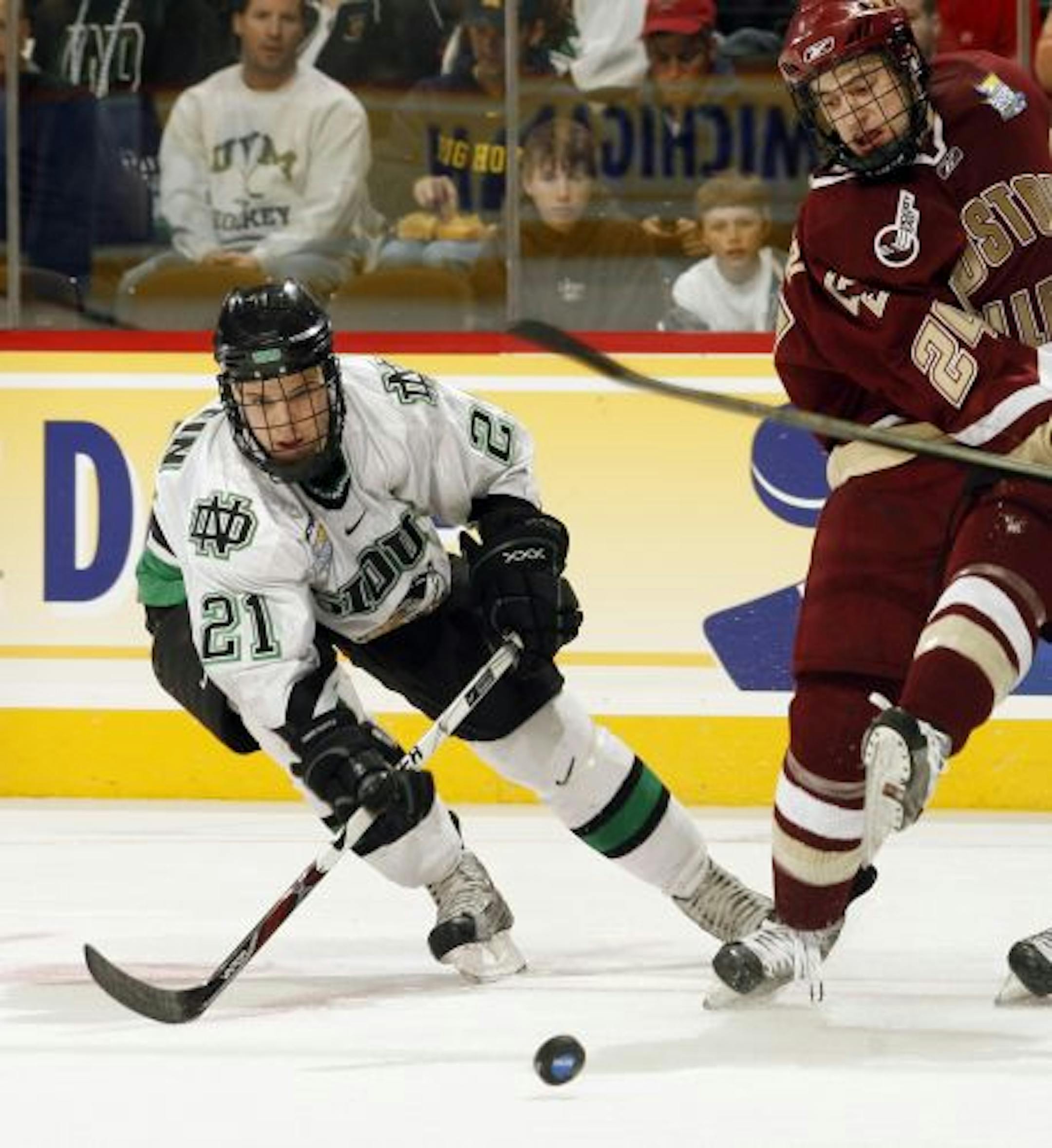 Matt Frattin (21) of the University of North Dakota during the Division I Men's Ice Hockey Semifinals held at the Pepsi Center in Denver, CO. Boston College defeated North Dakota 6-1 to advance to the national title game. Jamie Schwaberow/NCAA Photos